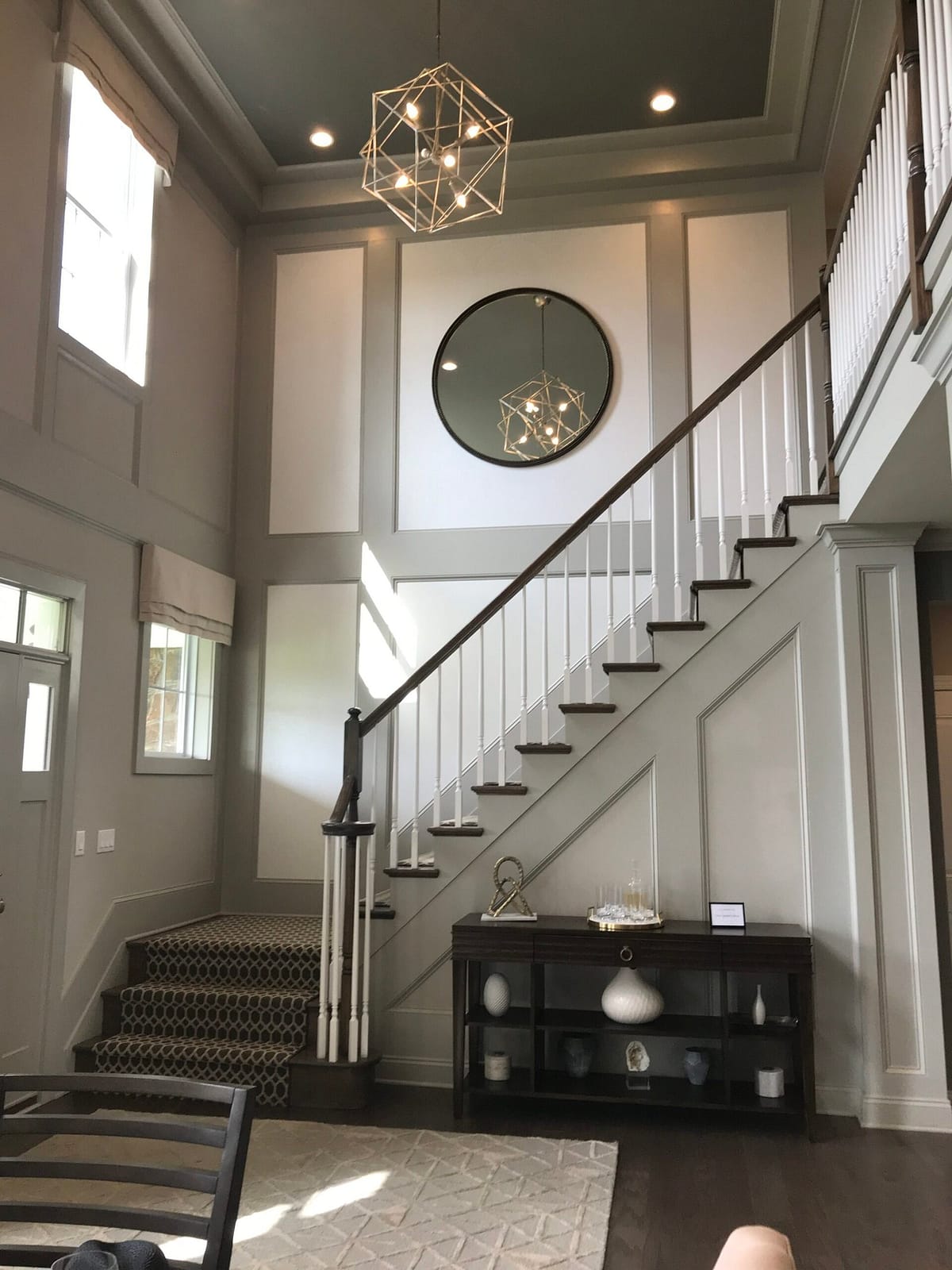 Custom Foyer Wall Panel Installation Two-story foyer featuring custom full-height wall panels and interior trim