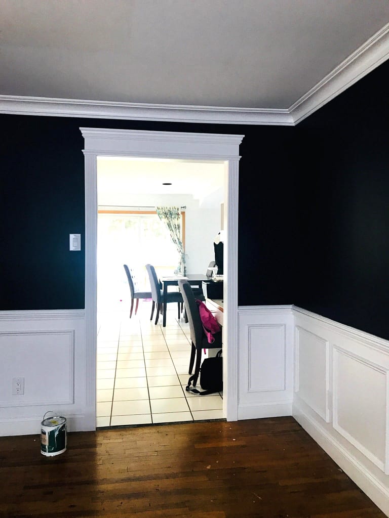 Wainscoting installers completed white picture-frame panels in a Monmouth County, NJ home