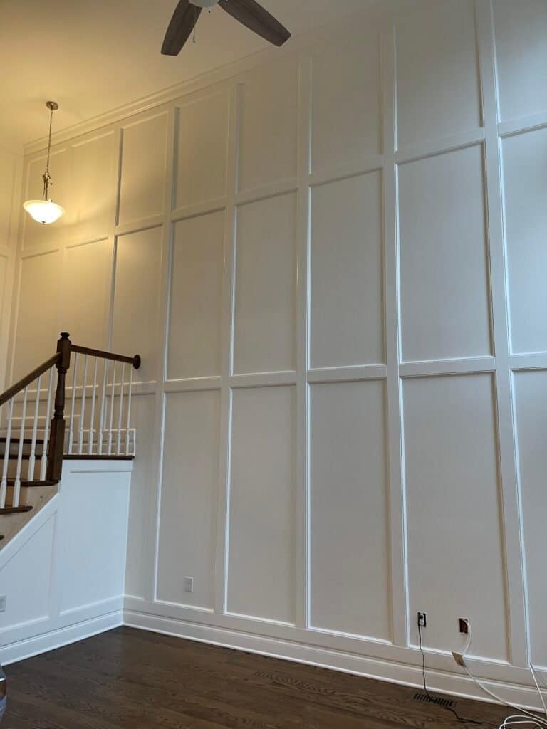 Full-height picture-frame wall panels in a two-story Monmouth County, NJ foyer