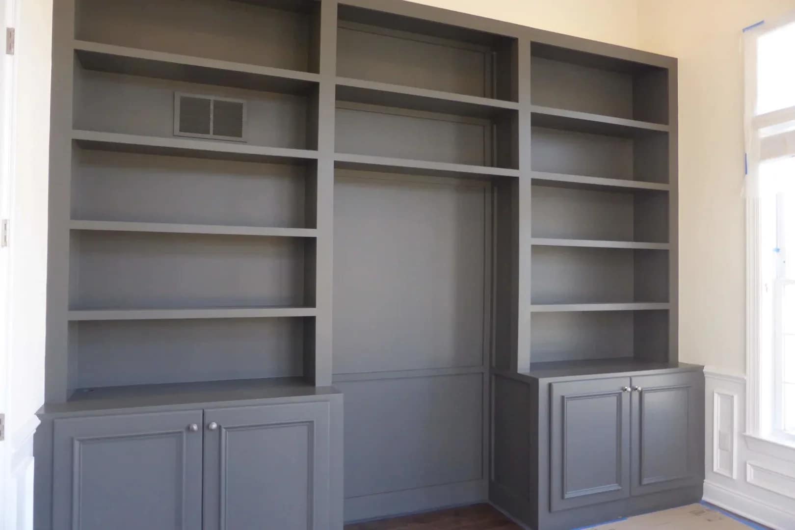Custom built-in bookcases and wall unit with lower storage cabinets in Monmouth County NJ
