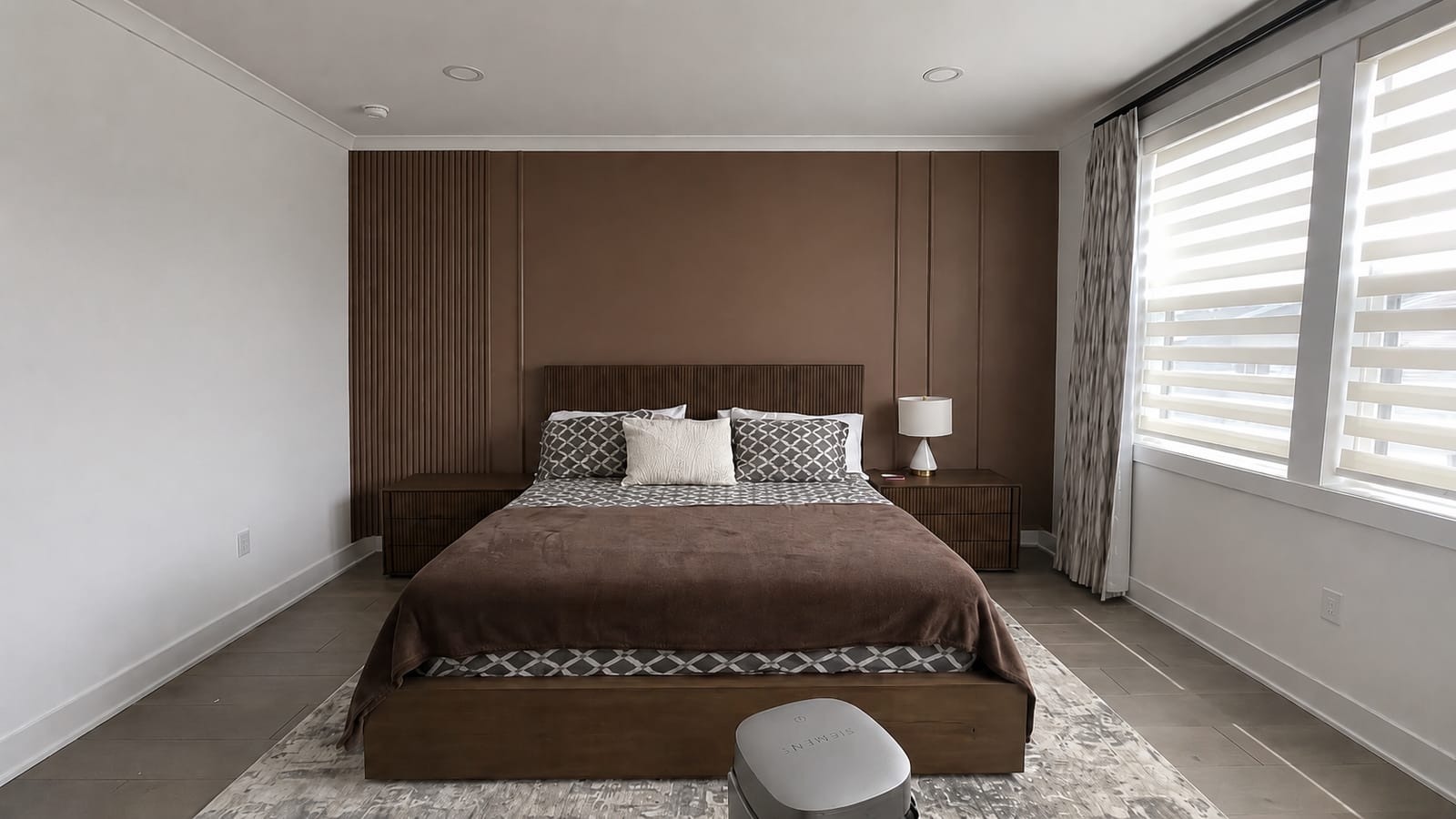 Dark custom wall panels installed behind a bed in a Monmouth County NJ home