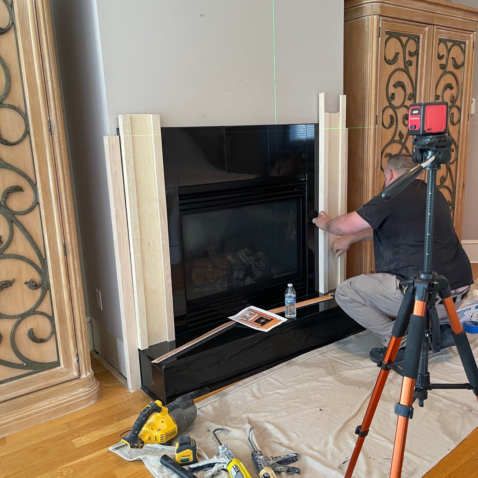 Custom wood fireplace mantel during installation in a Monmouth County NJ home